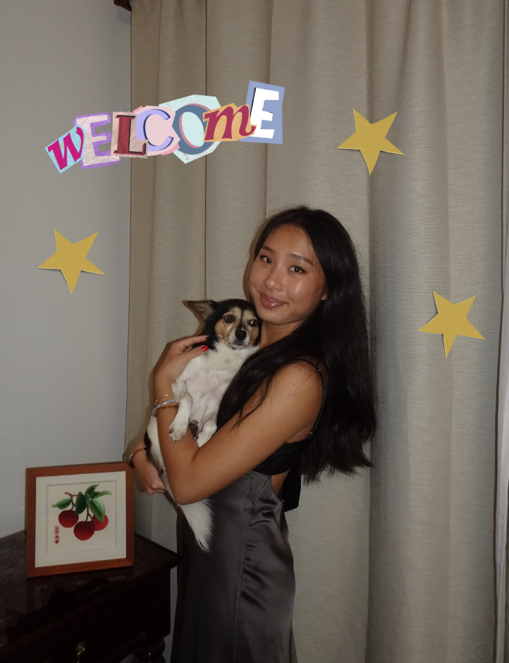 a photo of me, smiling at the camera. i am holding my dog.